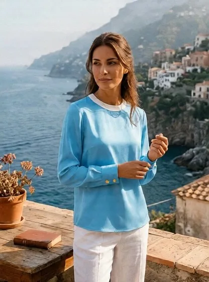 Light Blue Pull over with gold stars on elongated cuffs.
